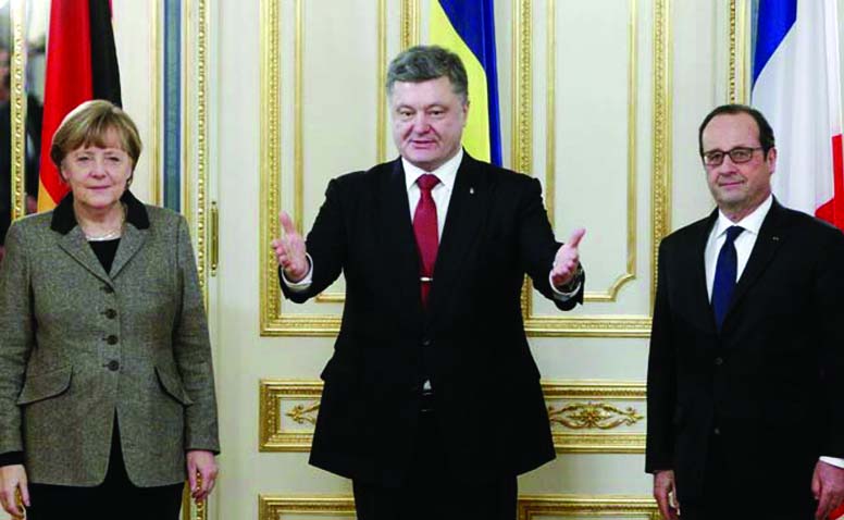 Ukraine's President Petro Poroshenko Â© with German Chancellor Angela Merkel and French President Francois Hollande during their talks in Kiev on Thursday.