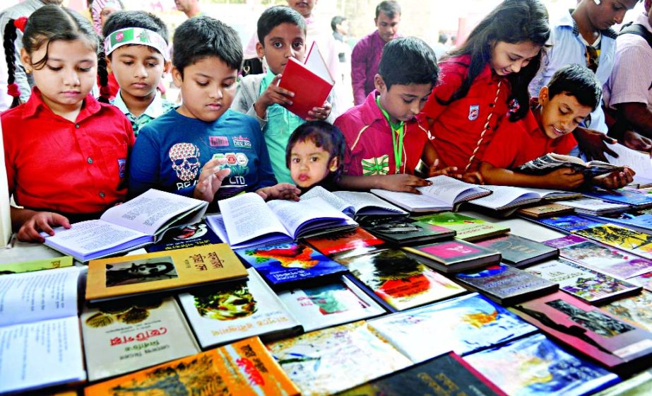 Children throng the Ekushey Boi Mela to choose their books at the Bangla Academy premises on Friday.