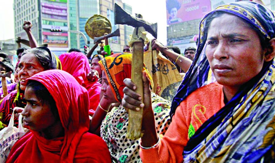 A group of day-labourers sit-in demo against hartal, blockade in front of Gulshan office of BNP Chief Begum Khaleda Zia on Saturday.
