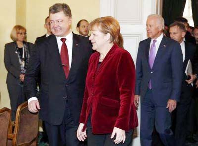 Ukraine's President Petro Poroshenko, German Chancellor Angela Merkel and US Vice President Joe Biden (L-R) arrive for a meeting during the 51st Munich Security Conference at the 'Bayerischer Hof' hotel in Munich on Saturday..