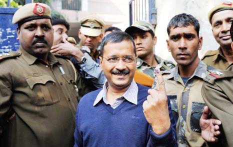 Aam Aadmi Party, or Common Man's Party, leader Arvind Kejriwal displays the indelible ink mark on his finger after casting his vote in New Delhi, India on Saturday.