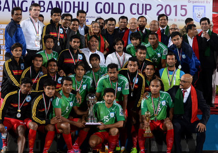 Members of Bangladesh National Football team, the runners-up of the Bangabandhu Gold Cup International Football Tournament with the chief guest Prime Minister Sheikh Hasina pose for a photo session at the Bangabandhu National Stadium on Sunday.