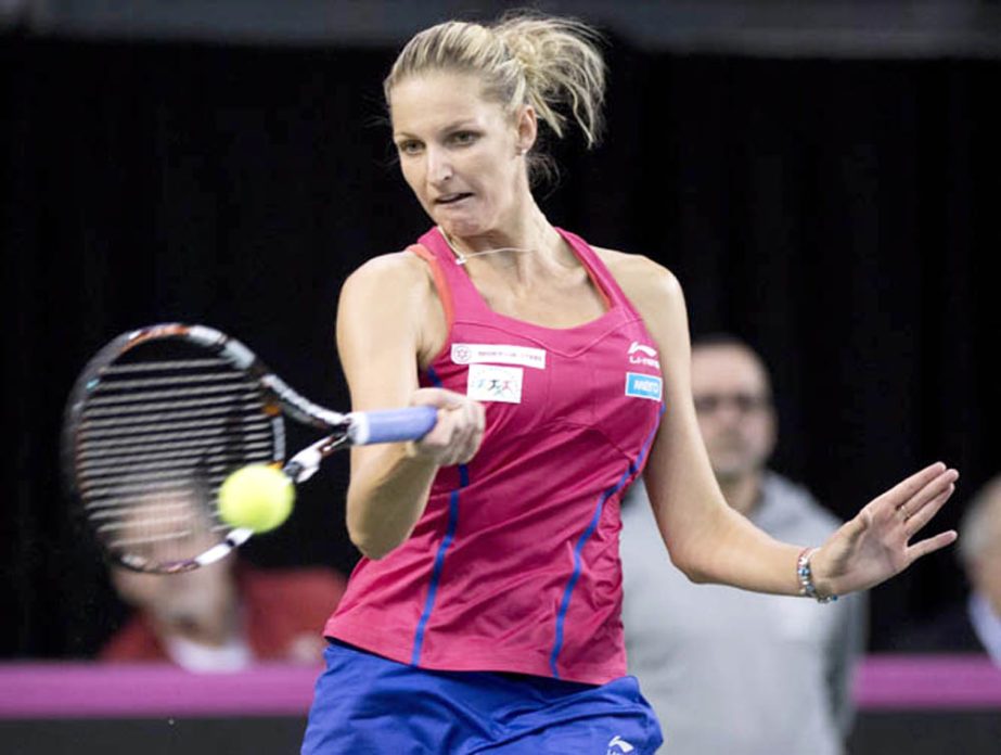 Czech Republic's Karolina Pliskova hits a return to Canada's Francoise Abana during a Fed Cup tennis singles match on Saturday in Quebec City. Kvitova won the opening match.