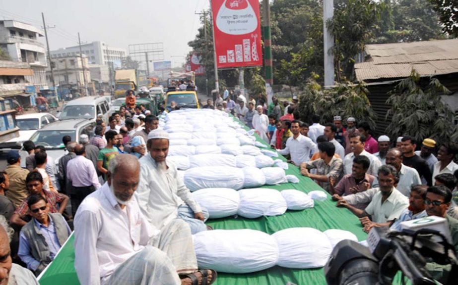 A rally with symbolic dead bodies protesting killings was brought out in Chittagong city on Sunday.