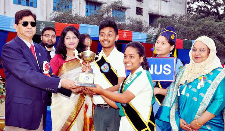 Air Officer Commanding of BAF Base Bashar Air Vice Marshal M Naim Hassan giving away trophy to Venus House who became champion in Annual Sports of BAF SEMS on Saturday.