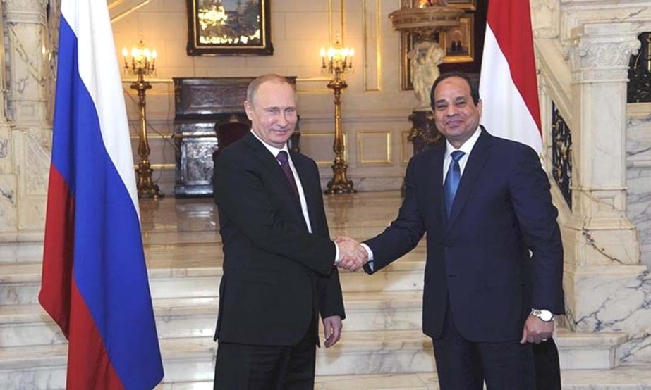 Russia's President Vladimir Putin (L) shakes hands with Egypt's President Abdel Fattah al-Sisi during a meeting in Cairo on Tuesday.