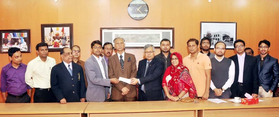 Director of Institute of Information Technology Dr Kazi Muhaymin-Us-Sakib handing over a cheque for Taka 11 lakh to DU Pro-Vice Chancellor (Administration) Prof Dr Shahid Akhtar Hossain on Wednesday at the Vice-Chancellor's office to introduce introduce