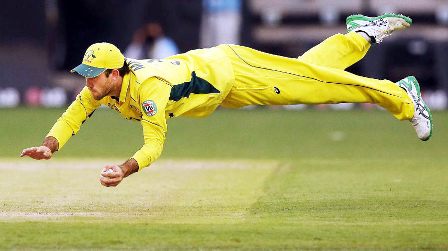 Glenn Maxwell takes an acrobatic catch to dismiss Shaiman Anwar during the World Cup warm-up between Australia and UAE at Melbourne on Wednesday.
