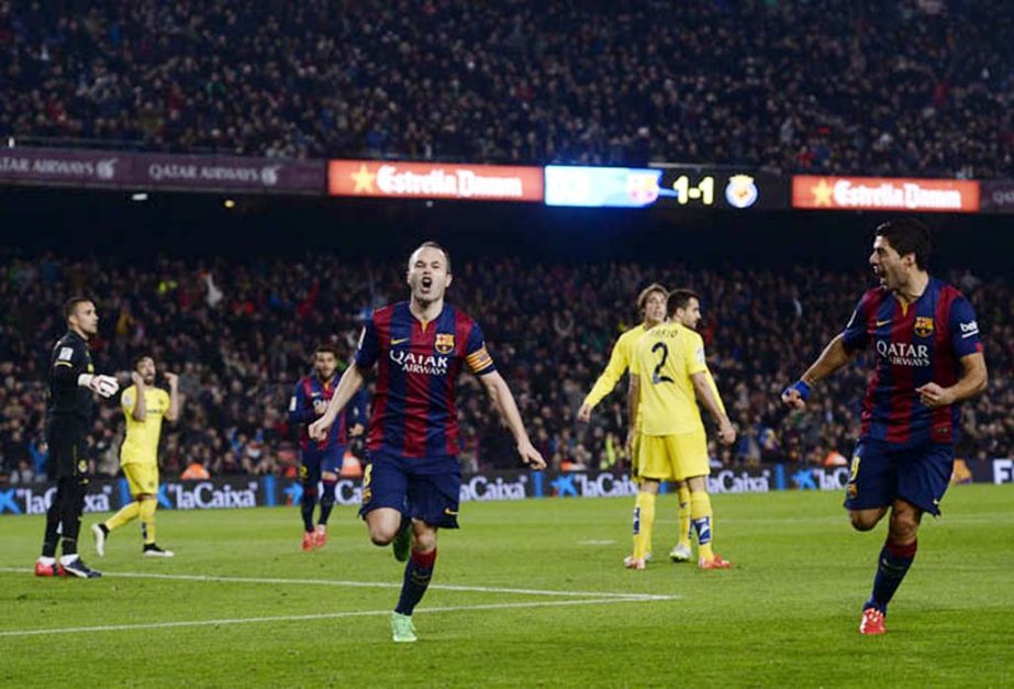 FC Barcelona's Andres Iniesta celebrates scoring against Villarreal during the semifinal, first leg, Copa del Rey soccer match at the Camp Nou stadium in Barcelona, Spain on Wednesday.