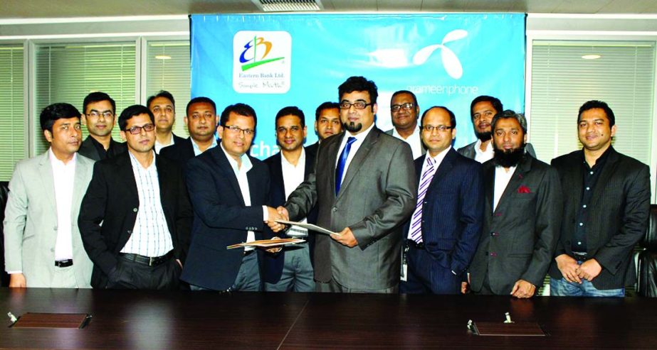 Nazeem A Choudhury, Head of Consumer Banking of Eastern Bank Ltd and Dilip Pal, Chief Financial Officer of Grameenphone sign a merchant agreement in the city recently to pay their all type of bills by using their credit or debit card through EBL Point of