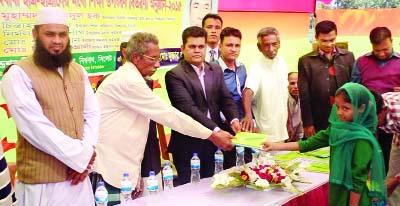 SYLHET: Mokter Ali Foundation distributing educational materials among the students at Dashpika Govt Primary School premises recently.