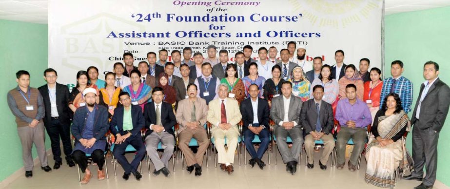 AQM Kibriya, Deputy Managing Director of BASIC Bank Limited, poses with the participants of a foundation course at its training institute. M Kamran Hamid, principal of the institute was present.