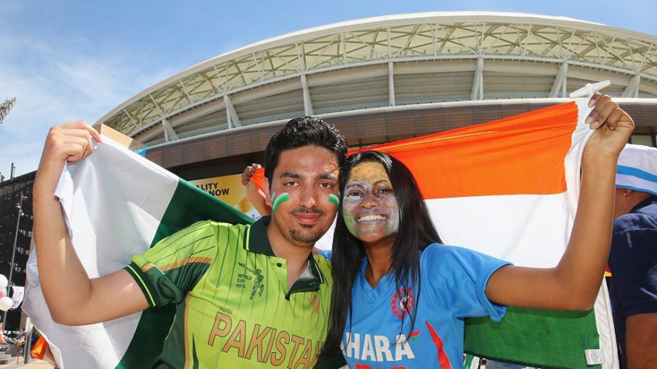 A Pakistani fan and an Indian fan strike a pose together during the 2015 ICC Cricket World Cup match between India and Pakistan at Adelaide Oval in Adelaide, Australia on Sunday.