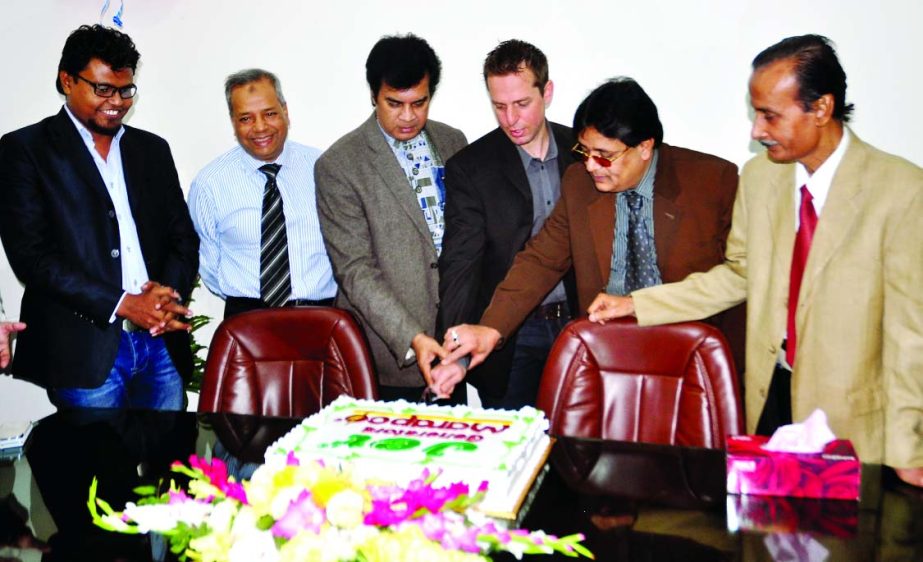 Director of Jubaili Bros Business Development Jed Jubaili, filmmaker Elias Kanchan and SH Power Pac Ltd Managing Director Shahjahan Mridha jointly inaugurating the sale of two generators, Marapco and Jet, in local market by cutting a cake.
