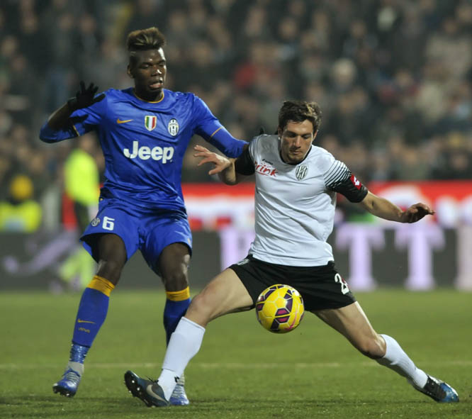 Cesena's Constantin Nica (right) vies for the ball with Juventus' Paul Pogba, during their Serie A soccer match at Cesena's Manuzzi stadium, Italy on Sunday.