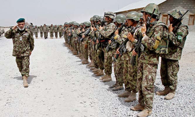 Afghan Army commander taking salute from soldiers in southern Afghanistan.