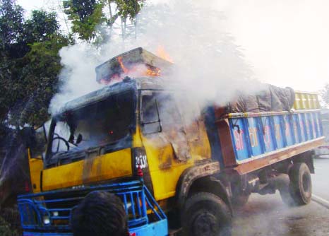 BOGRA: Miscreants fire set fire on a truck in front Gokul Balaka Cinemaa Hall in Bogra on Monday.