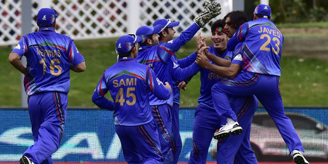 Afghanistan players celebrate during their early success in toppling over the Sri Lankan top order at the 12th match of the ICC cricket World Cup 2015 at Dunedin on February 22, 2015. Photo: AFP