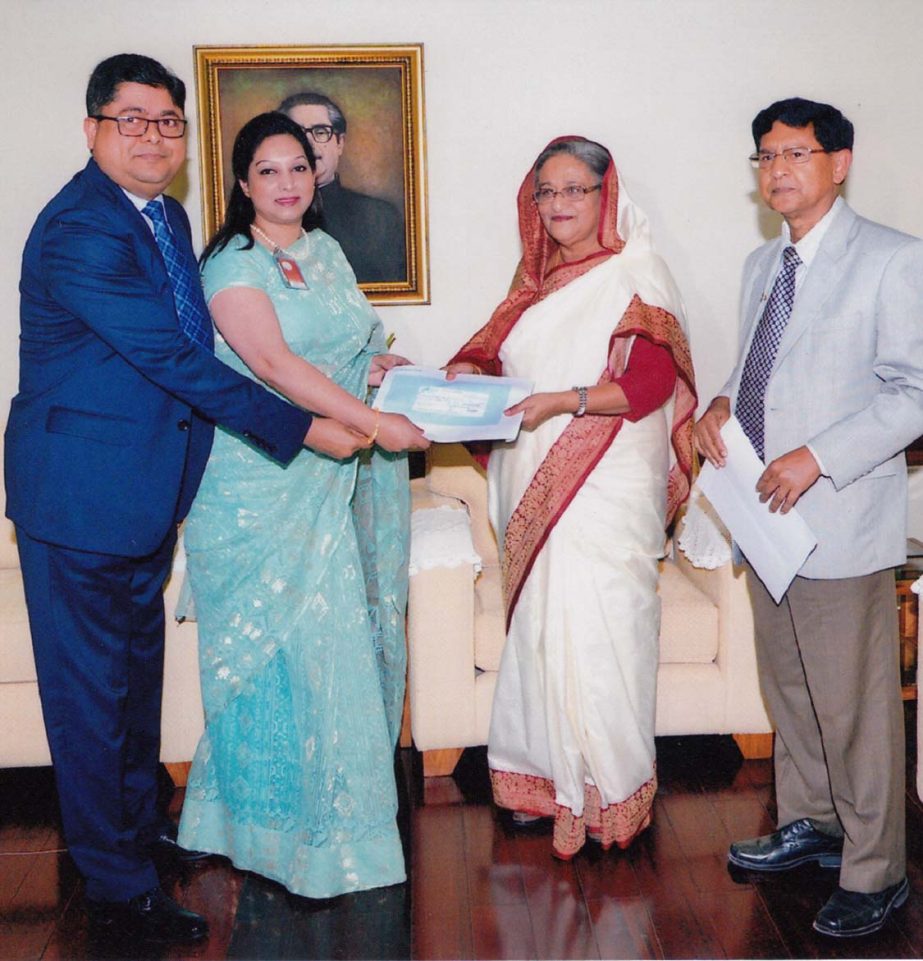 Prime Minister Sheikh Hasina receiving a cheque of Tk1.50 crore from Shaheen Mahmud, Chairman of Jamuna Bank Limited for her Relief Fund. Golam Dastagir Gazi, Bir Protik, MP, Director of the bank and Tasmin Mahmud were present.