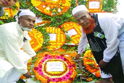 GAFARGAON(Mymensingh): Language martyr Abdul Jabbar's son Nurul Islam placing wreaths at Shaheed Minar at Jabbar Nagar to mark the International Mother Language Day on Saturday.