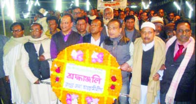 RANGPUR: Acting President of Rangpur District Awami League Mamtaz Uddin Ahmed with other leaders of AL and its front organisations placing wreaths at the Central Shaheed Minar on the occasion of Amar Ekushey on Saturday.