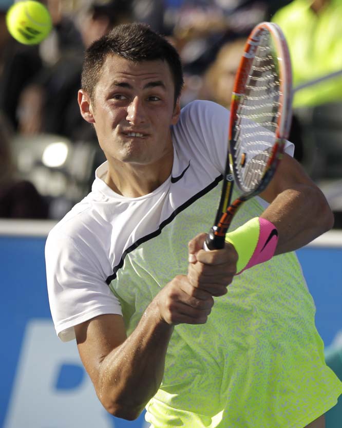 Bernard Tomic, of Australia, returns the ball to Donald Young during a semi-final tennis match at the Delray Beach Open on Saturday in Delray Beach, Fla. Young won 4-6, 6-4, 6-2.