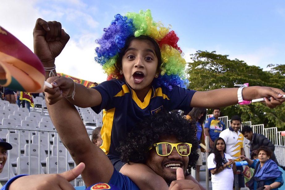 Sri Lankan fans celebrate their win after the Pool A 2015 Cricket World Cup cricket match between Sri Lanka and Afghanistan at University Oval in Dunedin on Sunday.