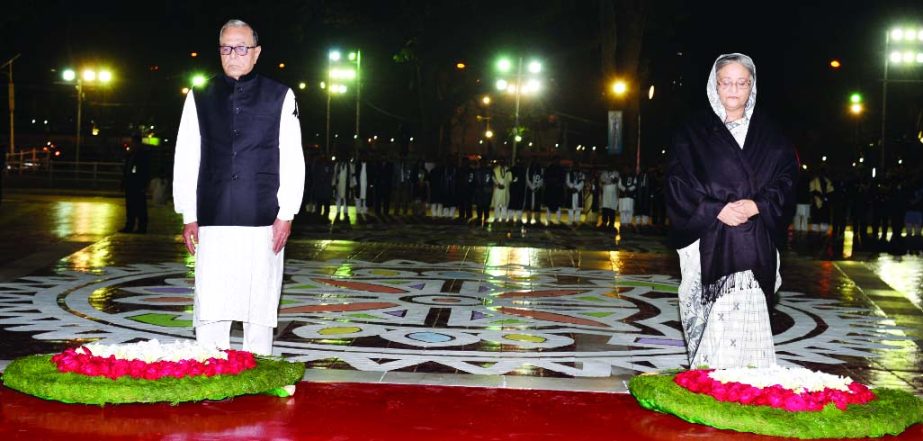 President Abdul Hamid and Prime Minister Sheikh Hasina stand in solemn silence after placing wreaths at the altar of Central Shaheed Minar as mark of respects to Language Martyrs on Saturday.
