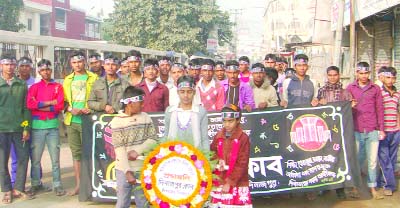 DINAJPUR: Members of Dinajpur Club placing wreaths at Dinajpur Central Shaheed Minar on the occasion of the International Mother Language Day on Saturday.