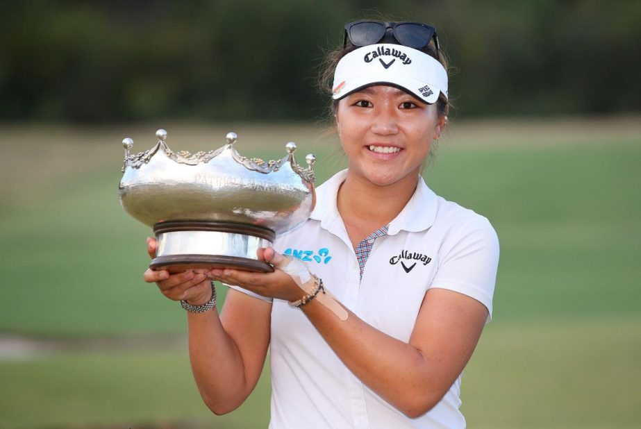 Lydia Ko of New Zealand celebrates victory and lifts the Patricia Bridges Bowl trophy at the presentation during day four of the LPGA Australian Open at Royal Melbourne Golf Course on Sunday in Melbourne, Australia.