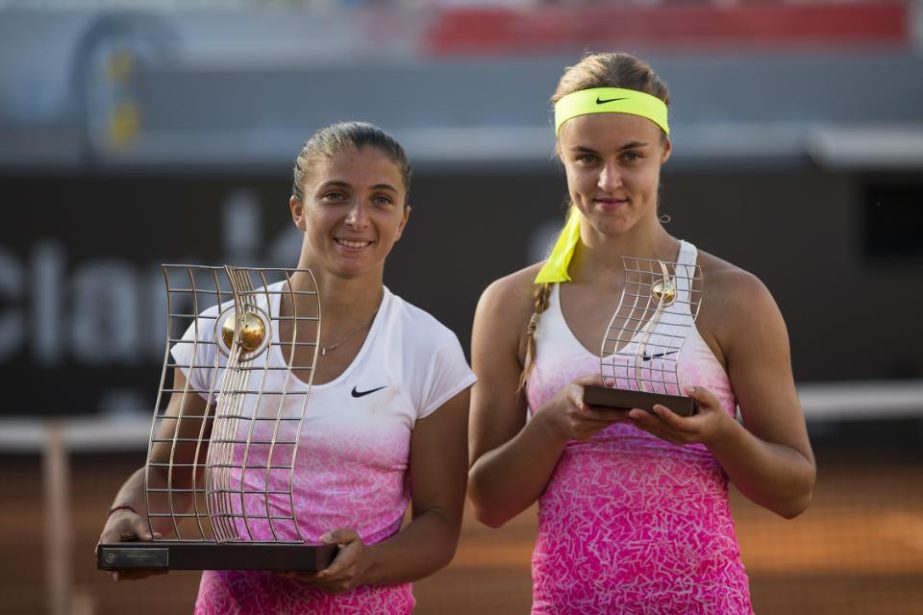 First place winner Sara Errani of Italy (left) and opponent Anna Schmiedlova of Slovakia, pose with their trophies at the end of the Rio Open tennis tournament women's final match in Rio de Janeiro Brazil on Sunday. Errani defeated Schmiedlova 7-6, 6-1.