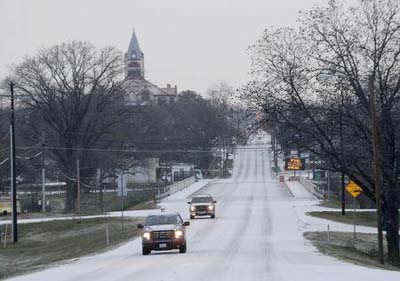 Ice and sleet covers the road, postponing the murder trial of former Marine Cpl. Eddie Ray Routh, in Stephenville, Texas on Monday.