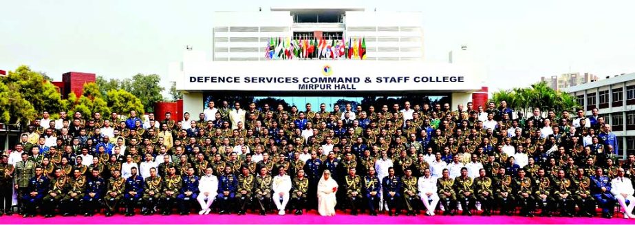 Prime Minister Sheikh Hasina along with the participants of different courses of Defence Services Command and Staff College poses for photograph at the concluding ceremony of the courses at Mirpur Cantonment on Tuesday.