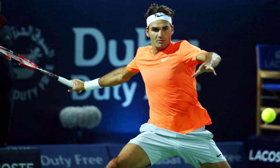 Roger Federer of Switzerland returns the ball to Mikhail Youzhny of Russia during their match on the first day of the ATP Dubai Duty Free Tennis Championships on Monday.