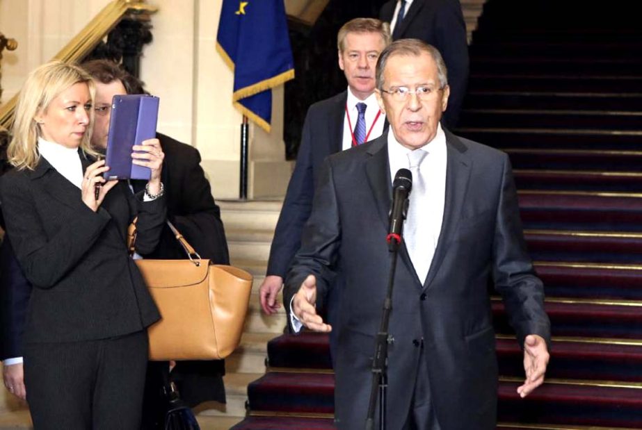 Russian Foreign Minister Sergei Lavrov speaks to reporters at the French Foreign Affairs Ministry following a meeting in Paris on Tuesday.