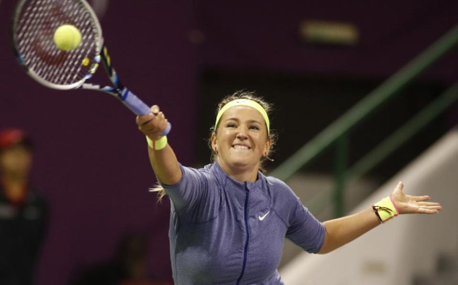 Victoria Azarenka of Belarus returns the ball to Venus Williams of the USA during their women's singles semi-final tennis match during the Qatar Open tennis tournament on Friday.