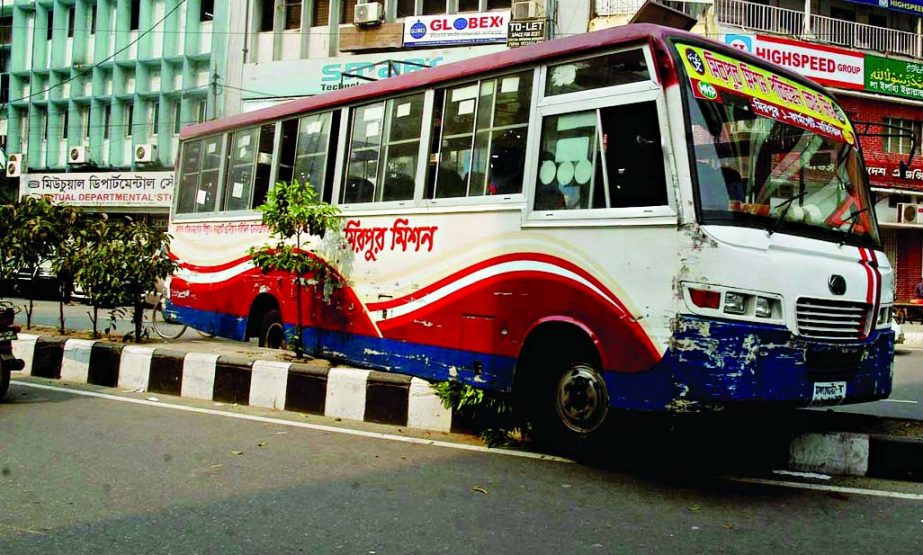 A passenger bus rammed the divider at the busy area in city. This photo was taken from Motijheel on Sunday.