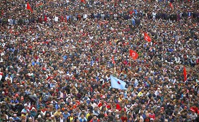People gather during a speech organized by the opposition alliance led by Unified Communist Party of Nepal (Maoist) in Kathmandu on Saturday.