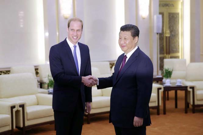 Britain's Prince William (L) meets Chinese President Xi Jinping at the Great Hall of the People in Beijing, on Monday.