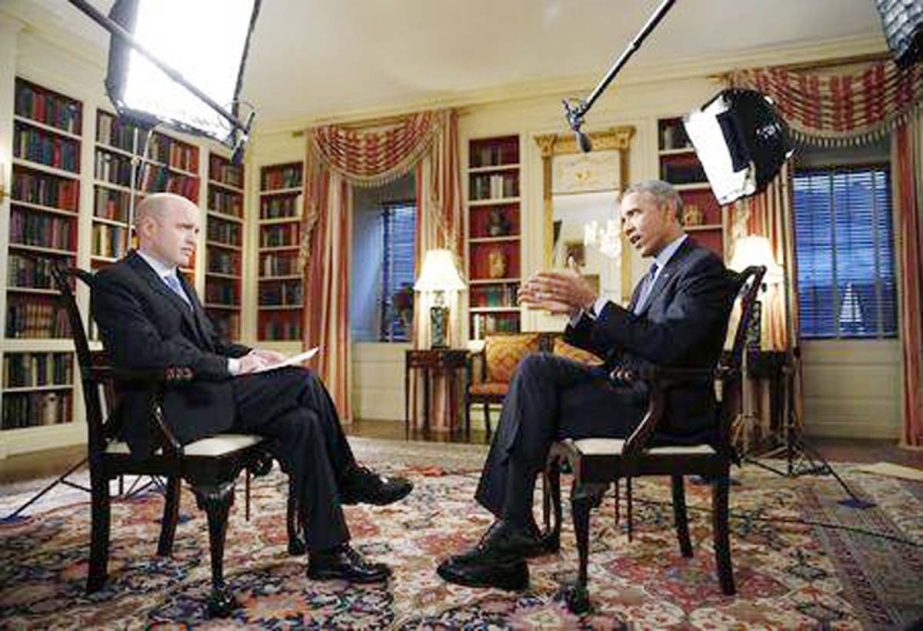 US President Barack Obama Â® speaks during an exclusive interview with White House Correspondent Jeff Mason in the Library of the White House in Washington.