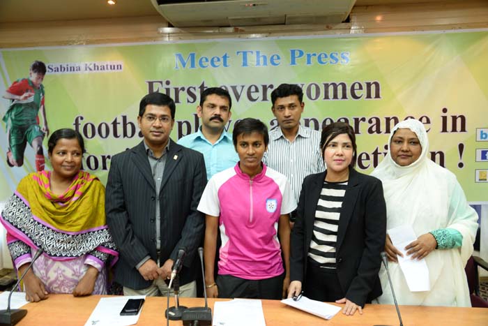 Player of Bangladesh National Football team Sabina Khatun (centre), Deputy Chairperson of Women's Wing of Bangladesh Football Federation (BFF) Mahfuza Akter Kiron (second from right) and the other BFF officials pose for a photo session at the conference