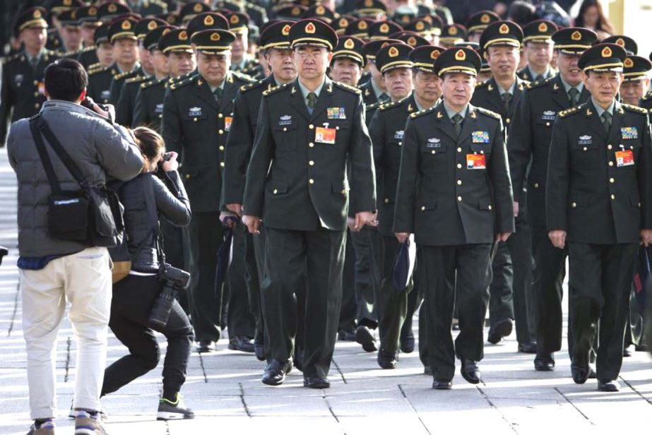 Chinese military officers arrive at the Great Hall of the People in Beijingon Wednesday.