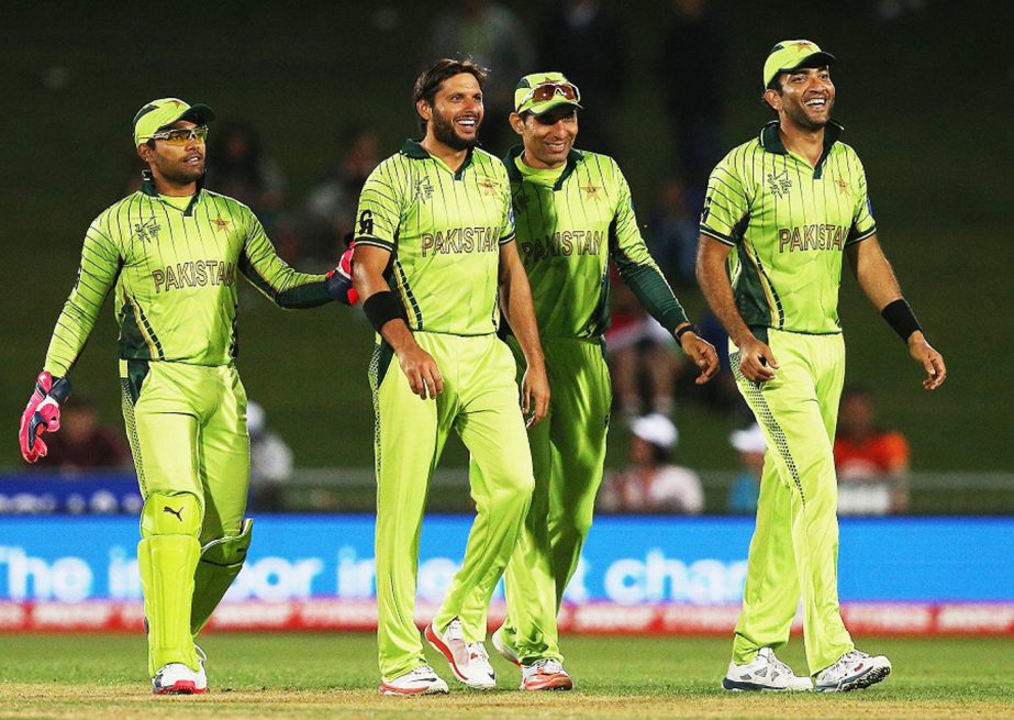 Shahid Afridi is flanked by his team-mates after dismissing Rohan Mustafa during the 2015 ICC Cricket World CUp match between Pakistan and the United Arab Emirates at McLean Park in Napier, New Zealand on Wednesday.