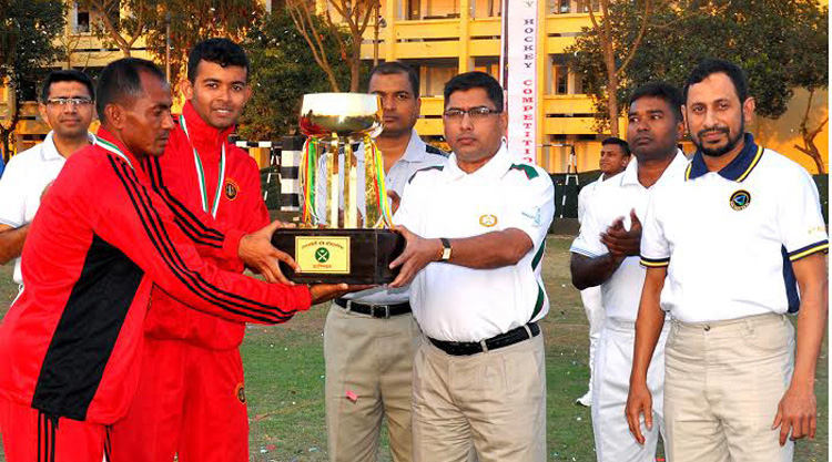 GOC of Ninth Infantry Division and Commander of Savar Area Major General Waqar-uz-Zaman handing over the championship trophy to Savar Area team, which emerged the champions of the Bangladesh Army Hockey Competition at the Savar Cantonment on Thursday.
