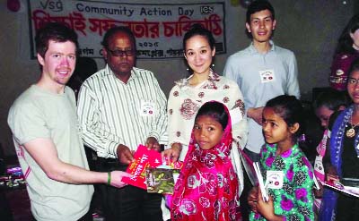 RANGPUR: Officials and volunteers of the UK- based International Citizen Service and Pairaband Jano Kallyan Unnayan Sangstha distributing educational materials among primary school students at a ceremony at Pairaband in Mithapukur Upazila on Tuesday.