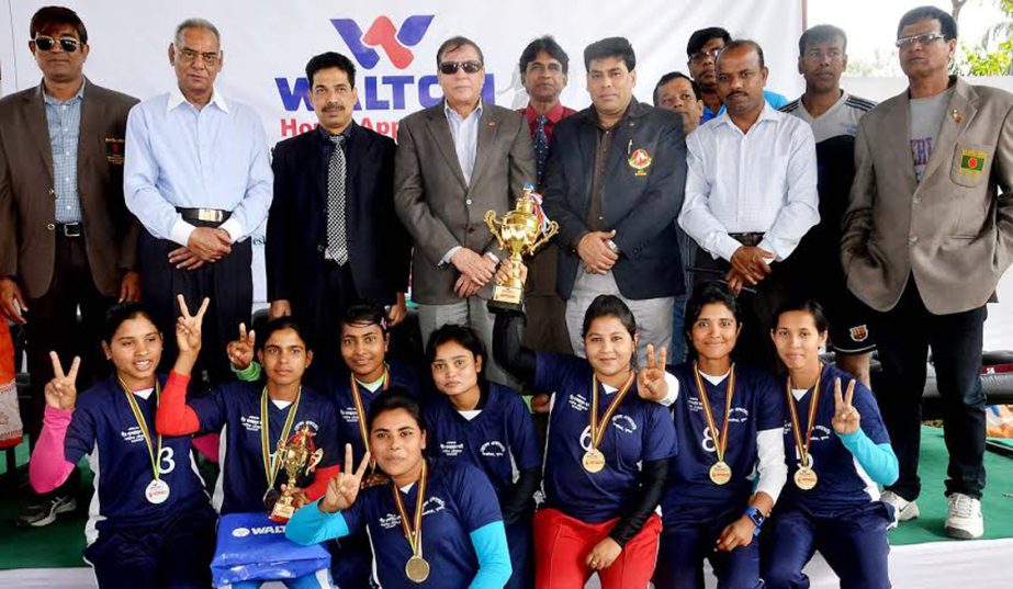 Players of Khulna Throwball Academy, the champions of the Women's Division of the Walton Home Appliance First National Throwball Competition with the guests and the officials of Bangladesh Throwball Association pose for camera at the Kabaddi Stadium on S