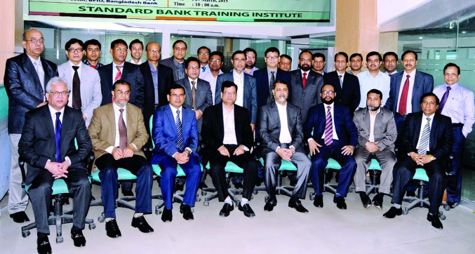 Md Nazmus Salehin, Managing Director and CEO of Standard Bank Limited poses with the participants of a day-long workshop on "Money Laundering Prevention & Combating Financing Terrorism" organized by the Training Institute of the bank recently. Mamun-Ur-