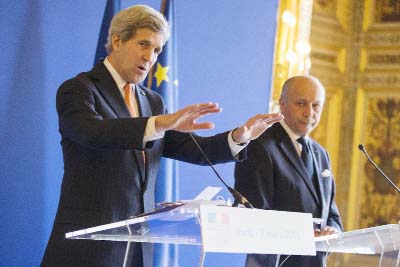 Secretary of State John Kerry, left, speaks to the media during a news conference with French Foreign Minister Laurent Fabius, on Saturday in Paris.