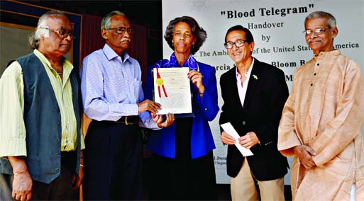 US Ambassador Mercia Stephens Bernicat handing over an authenticated copy of the 'Blood Telegram' with the seal of State Department to Liberation War Museum in Dhaka on Sunday.