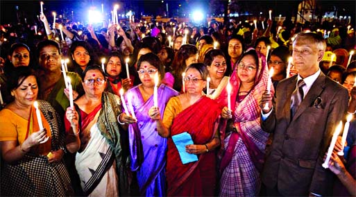 Amra-o-Pari and Dhaka University authority jointly organised the candle lighting at Central Shaheed Minar marking the International Women's Day on Sunday.